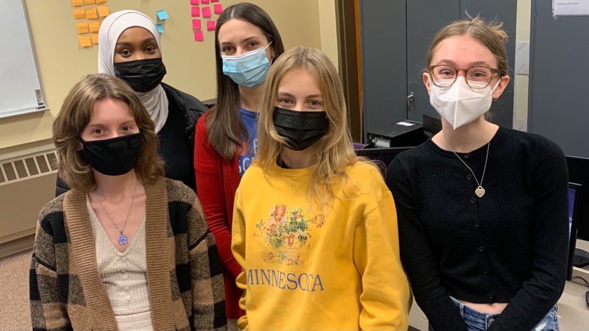 Club sponsor and computer science teacher, Megan Nyatawa (middle), poses with her students. Alyssa Carlson, Bosen Yusef, Macy White and Hadley Forsen-Yepes