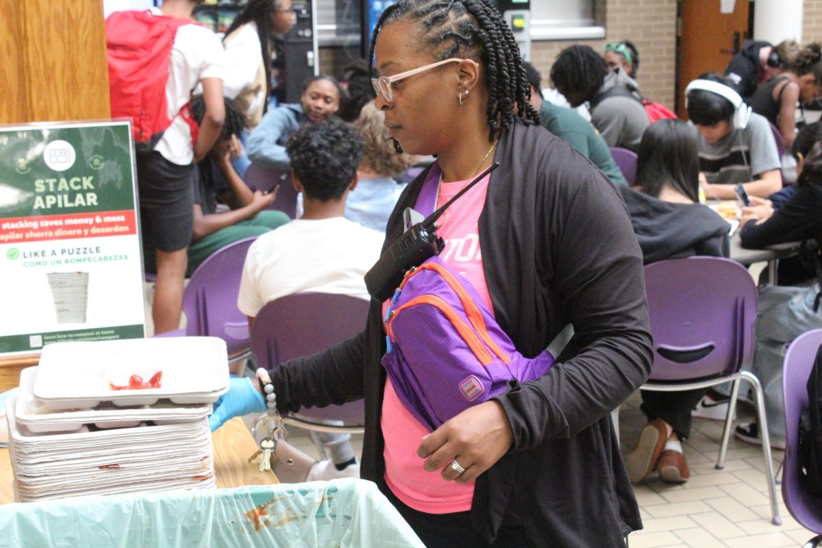 Dean Josette Lovercheck, organizes trays with Central's newest composting program.