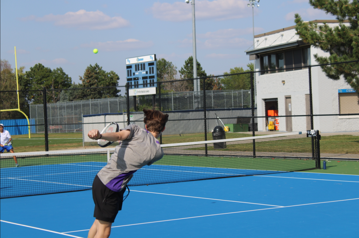 Junior varsity tennis player competing during match earlier this season
