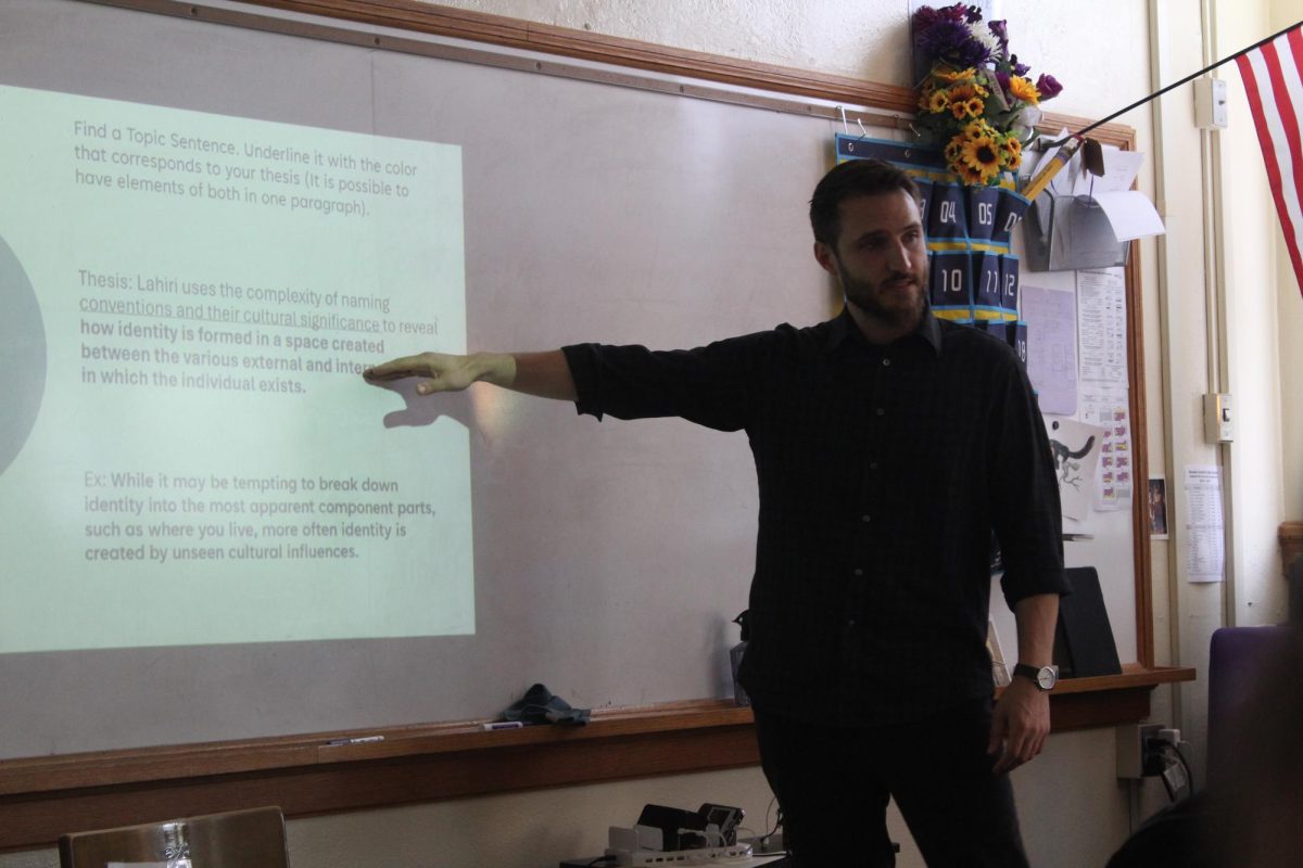 Benjamin Justman teaches in his classroom. 
