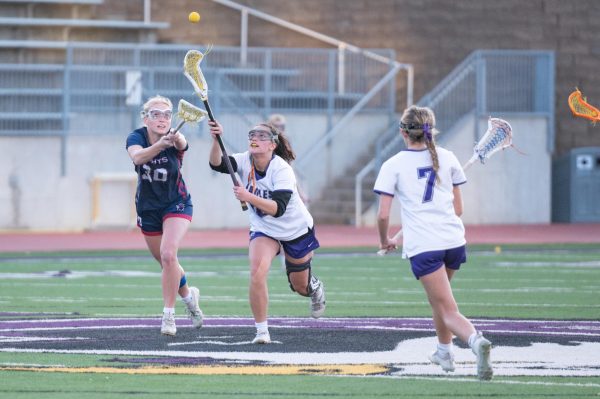 Junior Elizabeth McGovern runs to catch the ball versus Sarpy County Knights