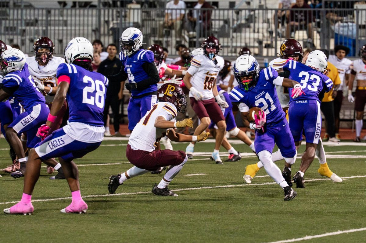Senior AJ Nichols runs with the ball to evade defenders versus Papillion-LaVista on Oct 10