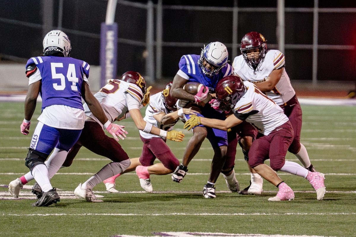 Junior Kylonn Haynie tries to fight off defenders versus Papillion-LaVista on Oct 10