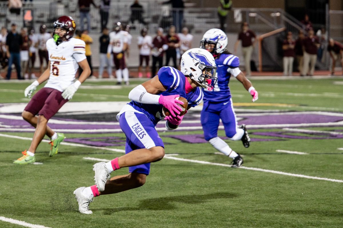Junior Tory Pittman runs with the ball after an interception versus Papillion-LaVista on Oct 10