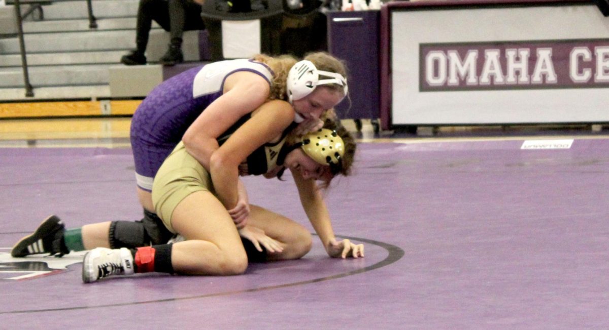 Freshman Kiera Webb-Dunn competes in match earlier this wrestling season.