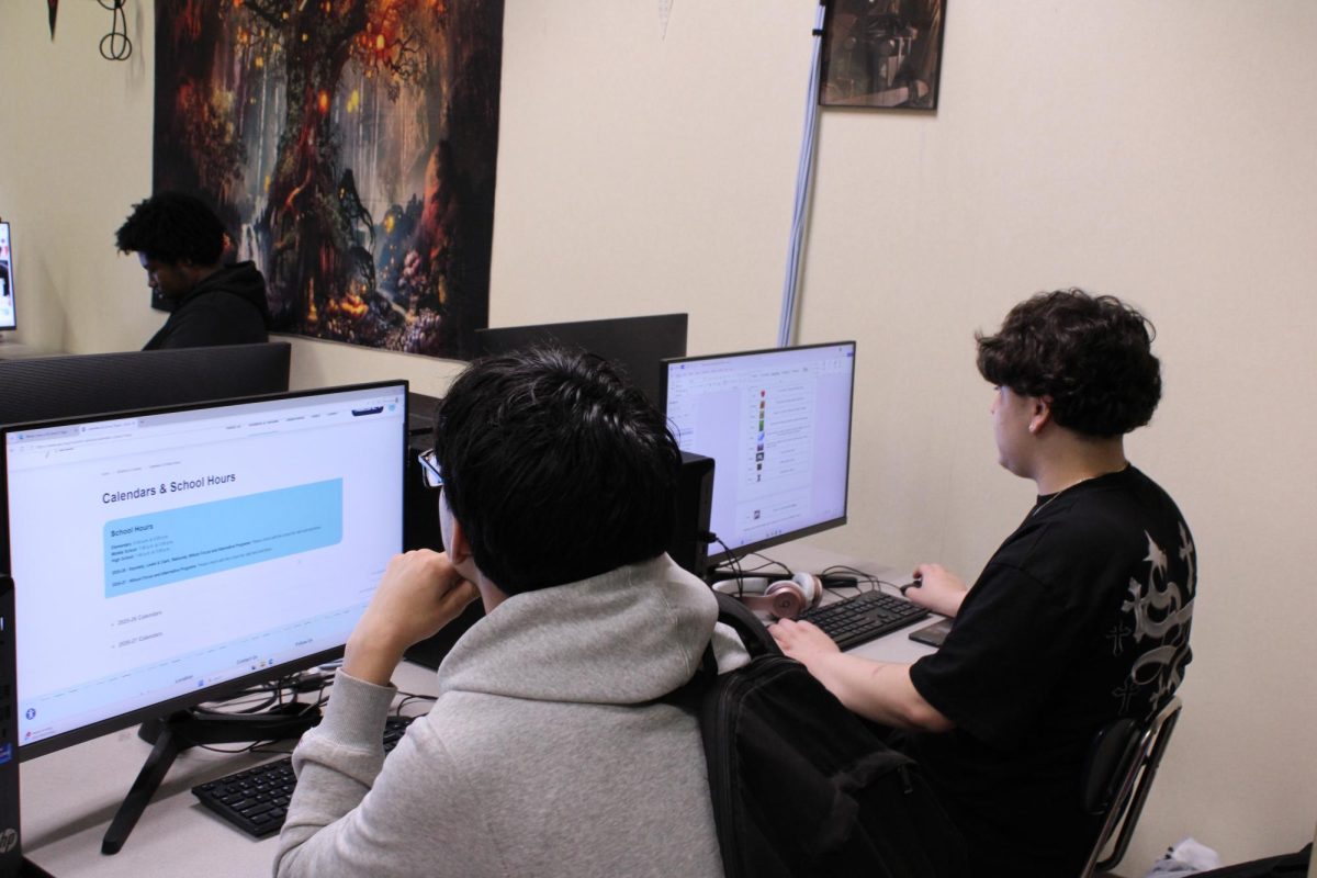 Junior Yahir Portillo and Sophomore Aaron Carmona in class doing work 