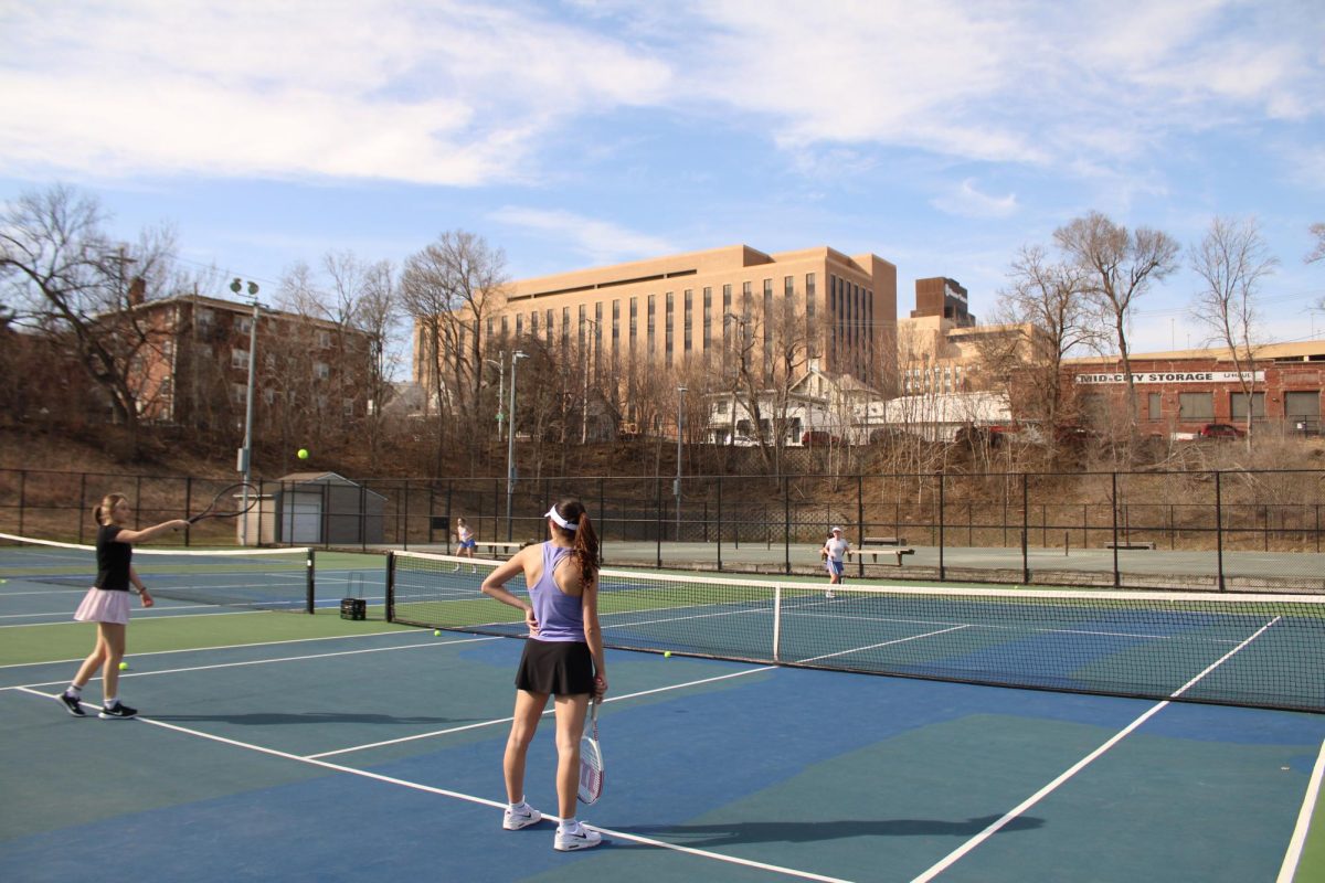 tennis practice at Dewey Park Tennis Courts near Midtown Crossing