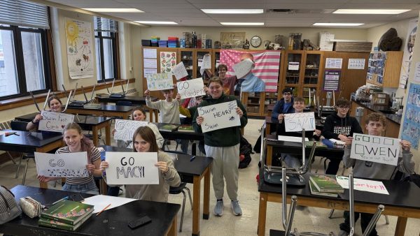 Central Girls and Boys State swim team gather before the 2026 meet to create posters for the Special Olympics Swimmers